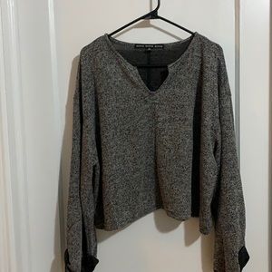 Cropped long sleeve white and black speckled shirt. NWOT